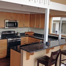 After kitchen remodel in Holly-Seabeck home featuring new layout and breakfast bar