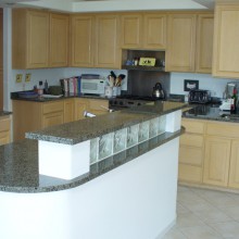 After kitchen remodel granite countertops, prep island and bar