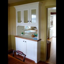 After renovation, custom built-in hutch with pass-through between dining room and kitchen