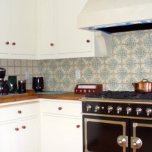 Kitchen remodel with custom tile backsplash and antique-style stove